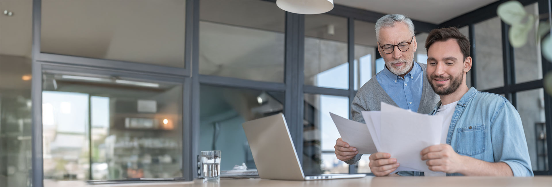 father helping his son with this documents