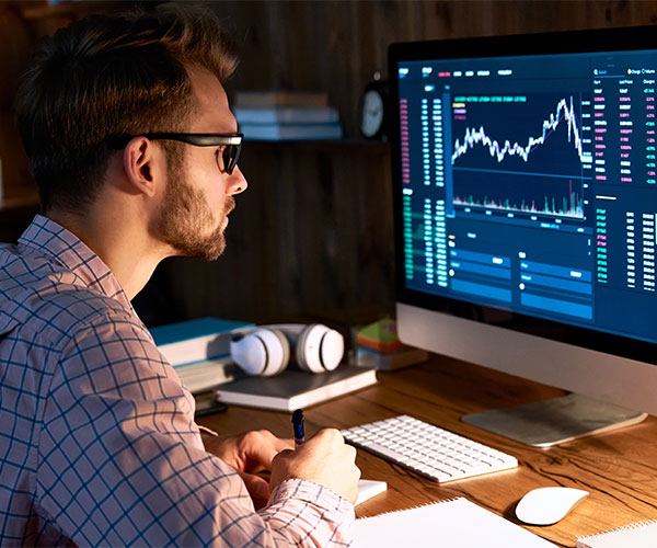 an arab woman writing on a book